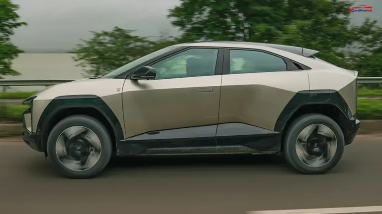 Mahindra BE 6 side profile coupe SUV design alloy wheels and aerodynamic shape