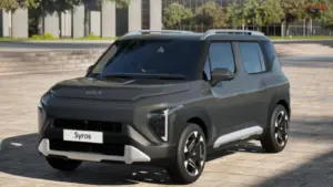 Kia Syros HTK EX front profile parked on road showcasing LED DRLs and alloy wheels