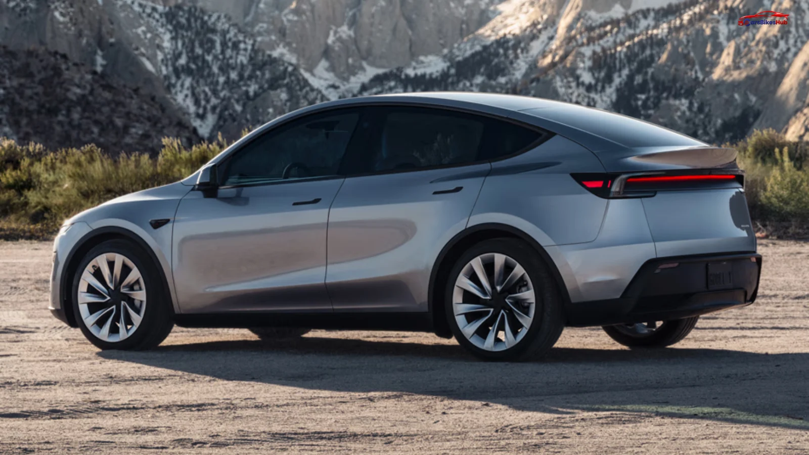 Front three-quarter view of the Tesla Model Y showcasing its futuristic LED lighting, aerodynamic body design, and premium electric SUV styling.