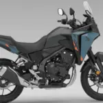 Honda NX500 E-Clutch adventure motorcycle parked on mountain road with touring setup
