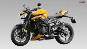 Triumph Street Triple 765 sport bike parked on a mountain road showcasing aggressive styling and premium naked motorcycle design