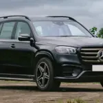 2026 Mercedes-Benz GLS luxury SUV parked on a city road showcasing premium design and bold front styling.