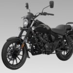 Bajaj Avenger Street 220 cruiser motorcycle parked outdoors showcasing its low-slung design and blacked-out styling