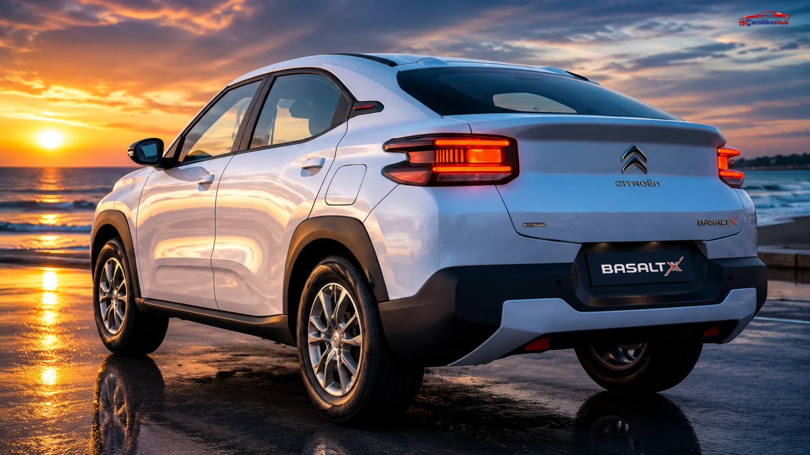 Rear three-quarter view of the Citroen Basalt X Comfort Edition parked by the waterfront at sunset, showcasing its coupe-SUV design and LED taillights.