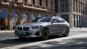 BMW i5 LWB parked on a city street in a luxury urban setting