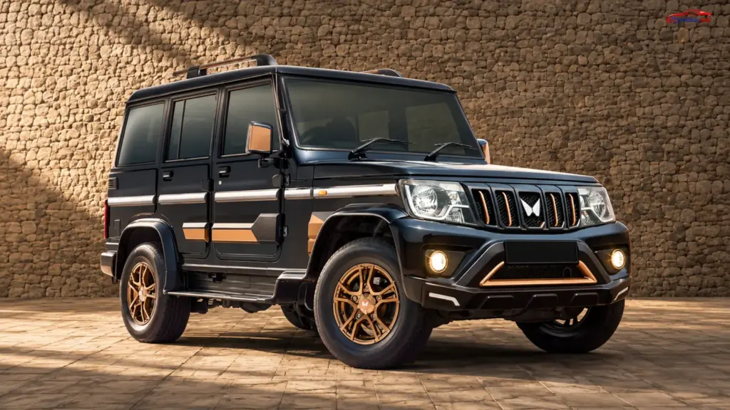2026 Mahindra Bolero Bold Edition in black with bronze exterior accents, bronze alloy wheels and roof rails.