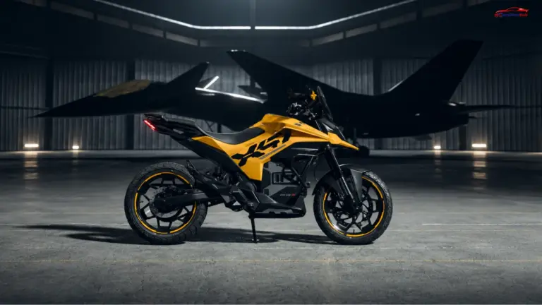 Ultraviolette X47 Venom electric motorcycle in yellow and black parked inside a dimly lit aircraft hangar.