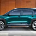 Maruti Suzuki Victoris Aurum Edition SUV in teal green with copper-coloured accents and alloy wheels.